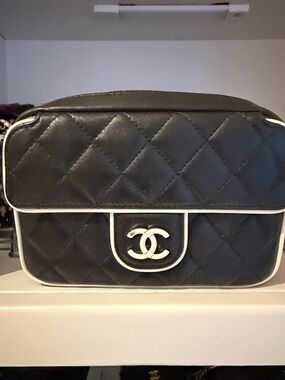 CHANEL Black Quilted Crossbody Bag with White Trim and CC Logo